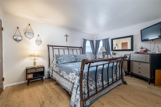 bedroom with light wood-type flooring