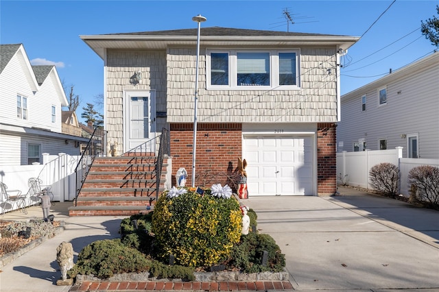 view of front of property with a garage