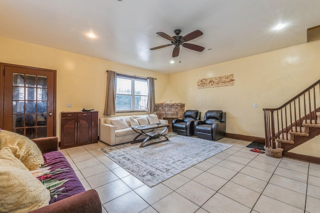 tiled living room featuring ceiling fan