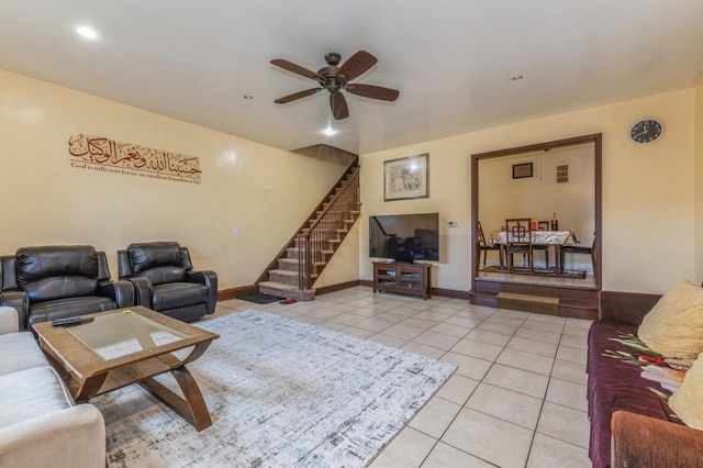 tiled living room featuring ceiling fan