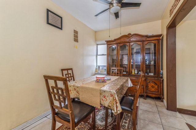 dining area with ceiling fan and light tile patterned floors