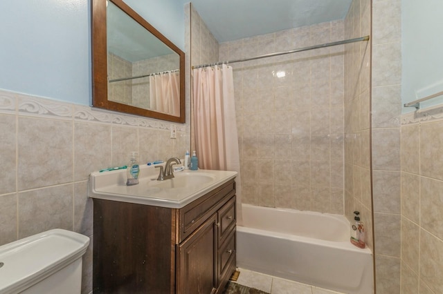 full bathroom with vanity, shower / bathtub combination with curtain, tile walls, and toilet