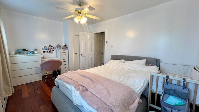 bedroom featuring ceiling fan and dark hardwood / wood-style flooring