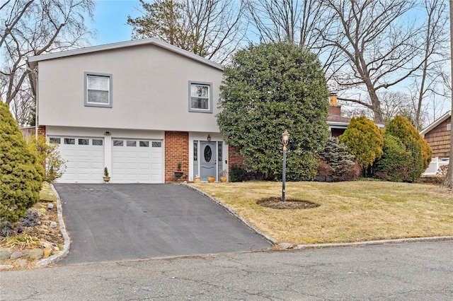 view of front of property with a garage and a front yard