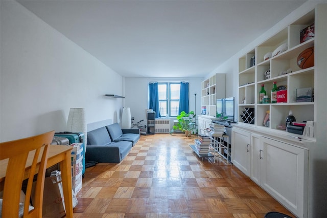 interior space featuring radiator and light parquet flooring