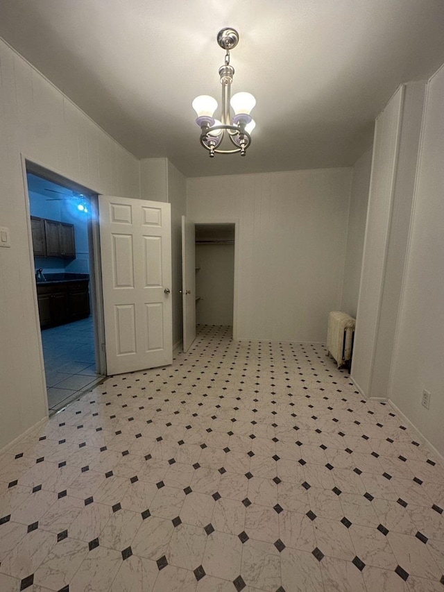 interior space with an inviting chandelier and radiator