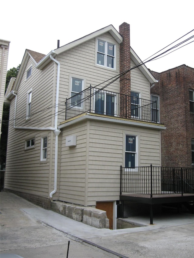 back of property with a balcony