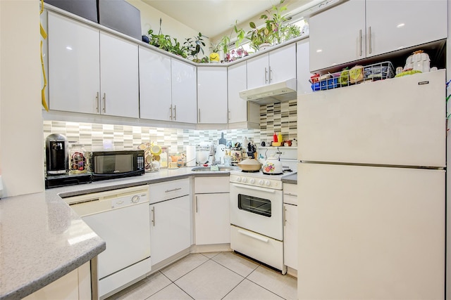 kitchen featuring tasteful backsplash, white cabinetry, light tile patterned floors, and white appliances