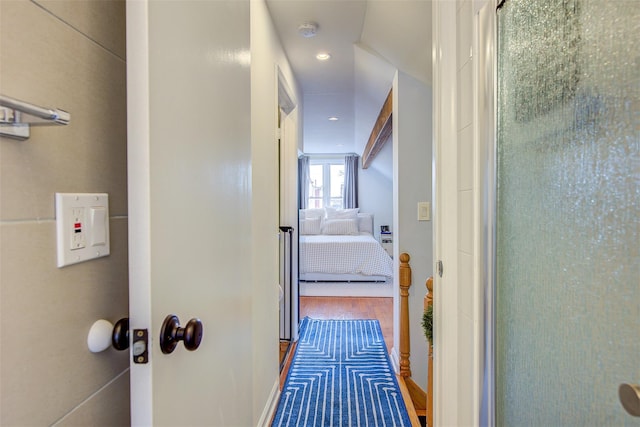 hallway with hardwood / wood-style floors