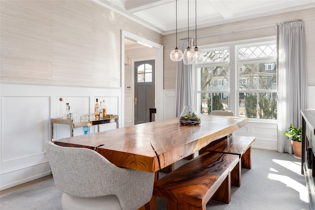 dining space featuring coffered ceiling, beam ceiling, and ornamental molding