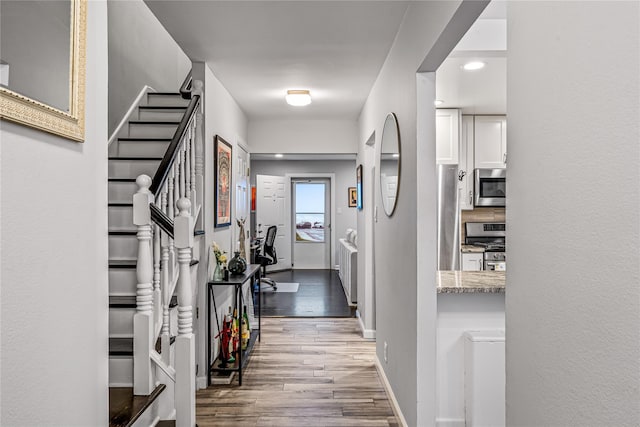 17-39215THSTREET 215th St # 35, Bayside, NY 11360 - corridor featuring baseboards, wood finished floors, and stairs