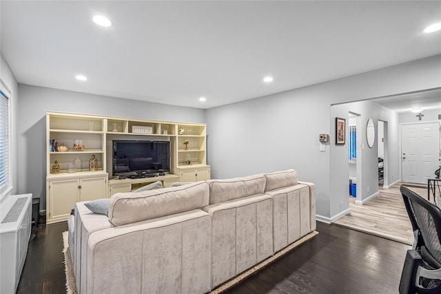 living room featuring dark hardwood / wood-style flooring