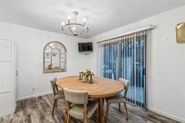 dining room with a notable chandelier and wood-type flooring