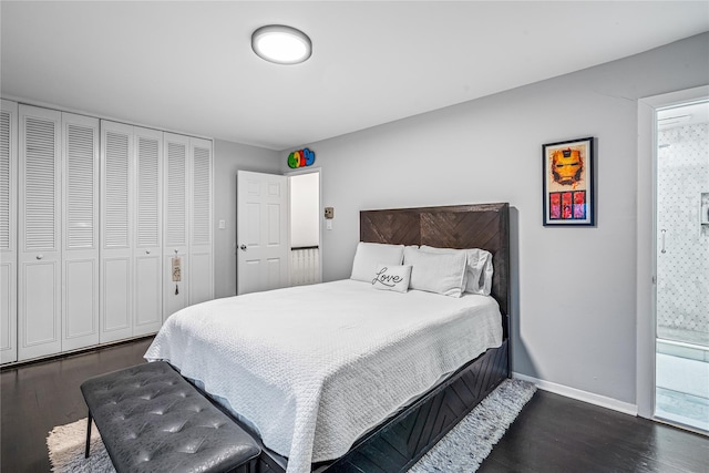 bedroom with dark hardwood / wood-style flooring