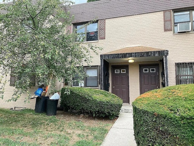 entrance to property featuring cooling unit