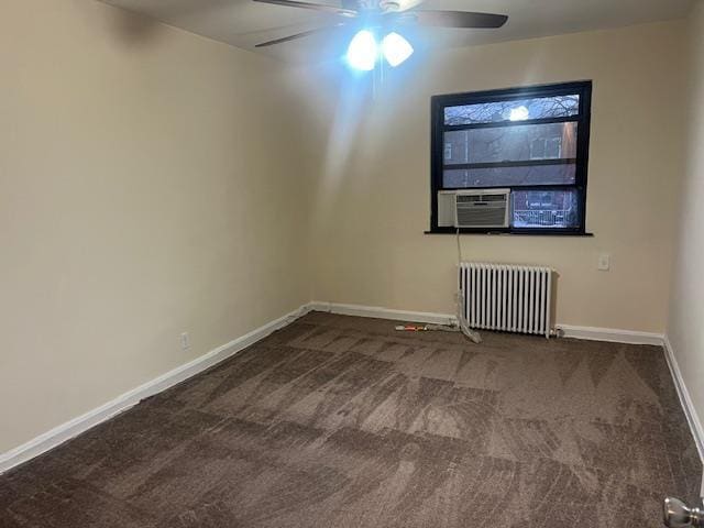 spare room featuring ceiling fan, cooling unit, carpet floors, and radiator