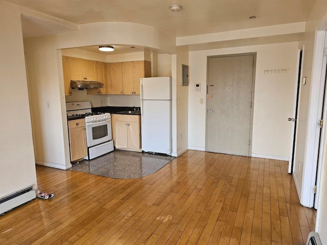 kitchen with light wood-type flooring, white appliances, baseboard heating, and light brown cabinetry