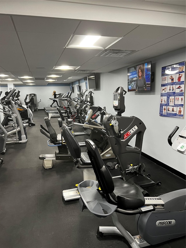 exercise room featuring a paneled ceiling