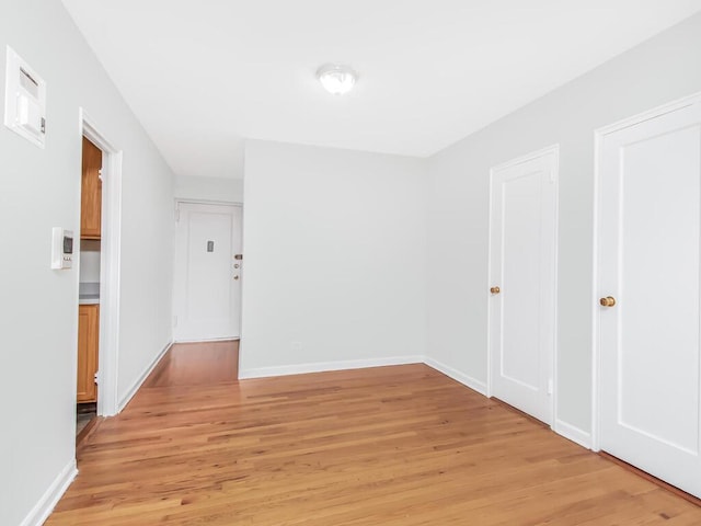 spare room featuring light wood-type flooring