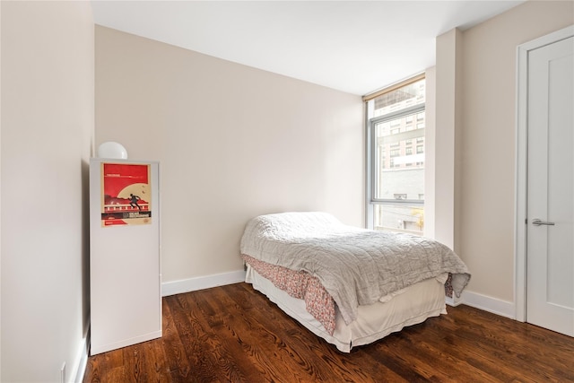 bedroom featuring dark hardwood / wood-style flooring