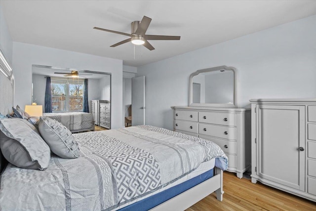 bedroom with light wood-type flooring and ceiling fan