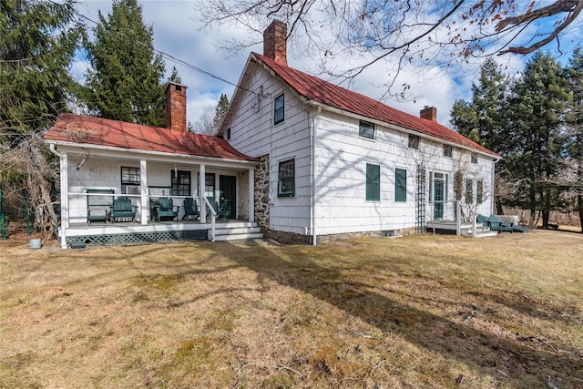 view of front facade with covered porch and a front yard