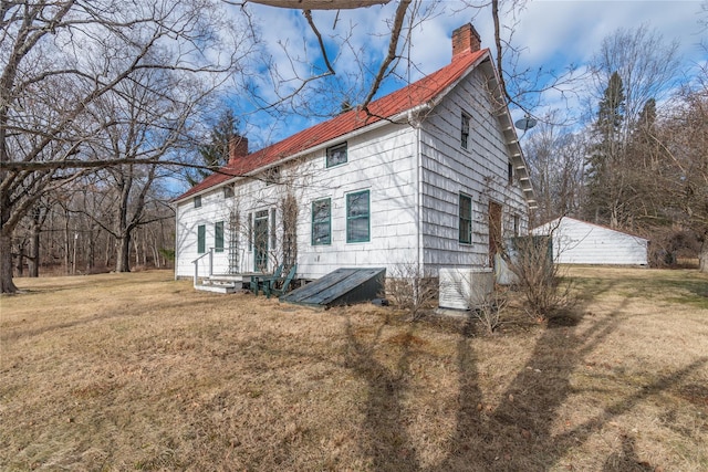 view of property exterior with a yard