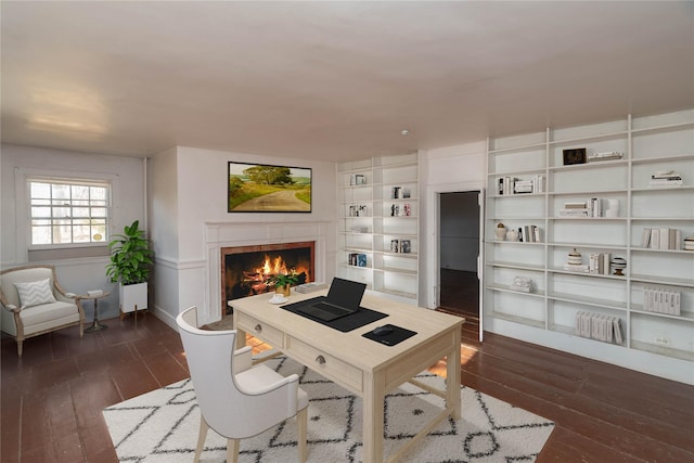 office area featuring built in features and dark wood-type flooring