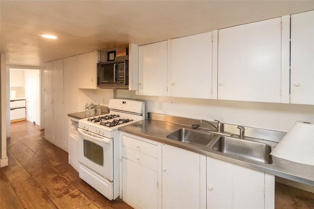 kitchen featuring white gas range, white cabinetry, sink, and dark hardwood / wood-style floors