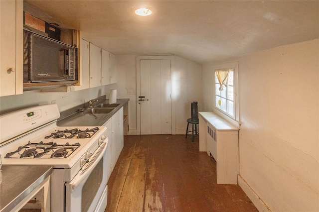 kitchen featuring sink, dark hardwood / wood-style flooring, lofted ceiling, white cabinets, and white gas range oven