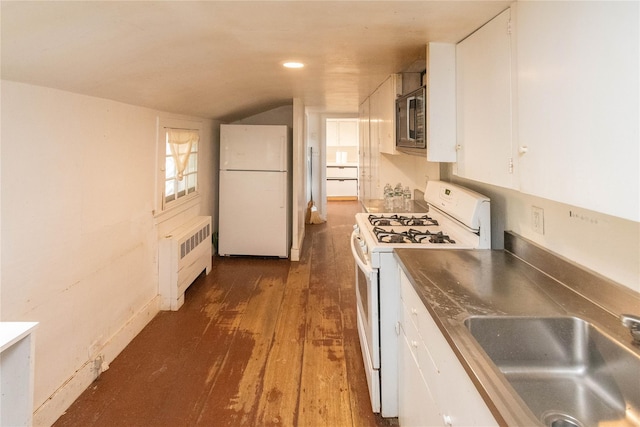 kitchen featuring radiator, white appliances, sink, white cabinets, and dark hardwood / wood-style floors