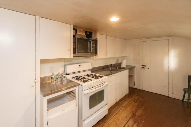 kitchen with dark hardwood / wood-style floors, white cabinetry, white gas stove, and sink