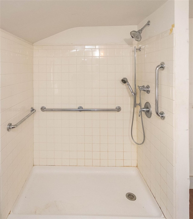 bathroom with tiled shower