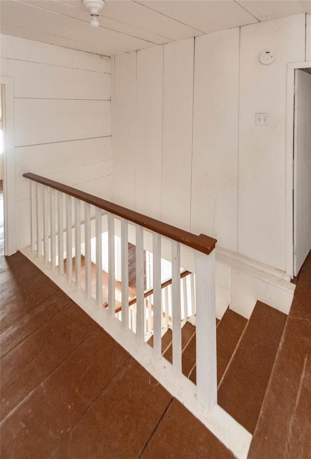 stairway with wood walls