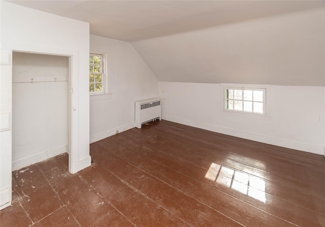 bonus room featuring radiator and lofted ceiling