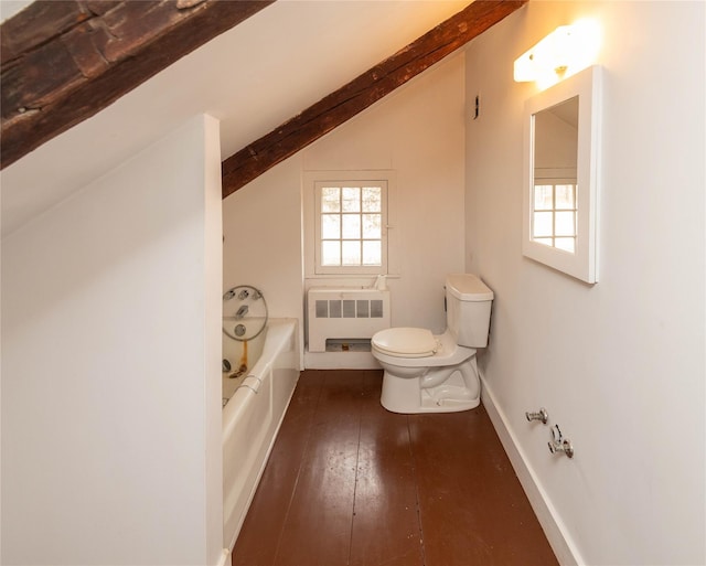 bathroom with hardwood / wood-style flooring, vaulted ceiling, radiator, and plenty of natural light