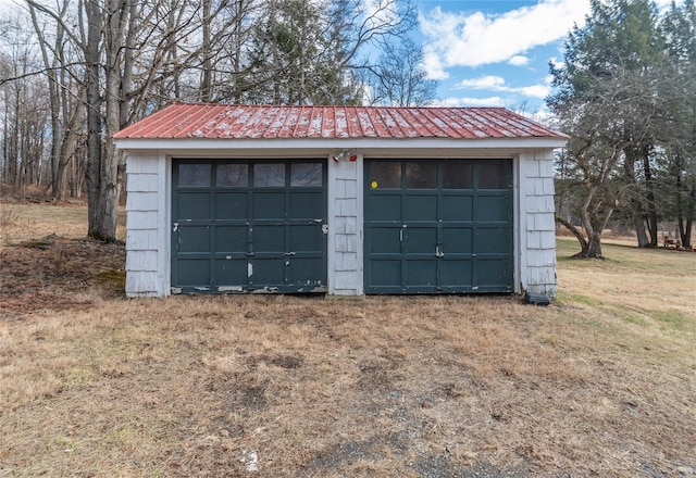 garage featuring a yard