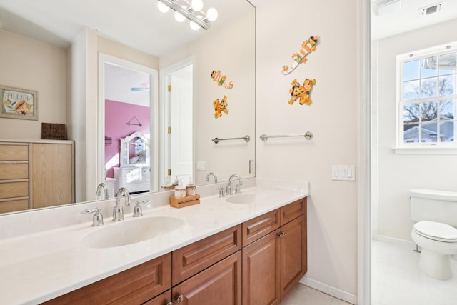 bathroom with vanity and toilet