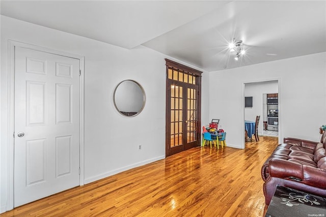 living room featuring wood-type flooring and french doors