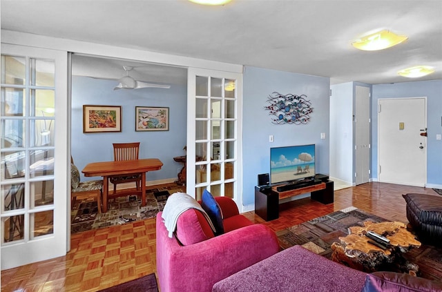 living room with parquet floors and ceiling fan