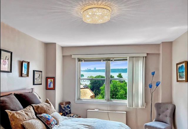 bedroom featuring a notable chandelier