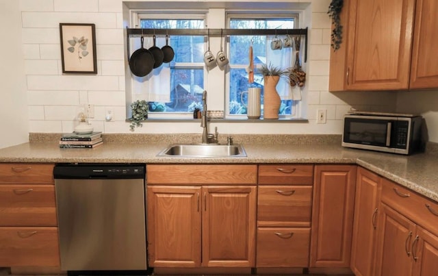 kitchen with sink and appliances with stainless steel finishes