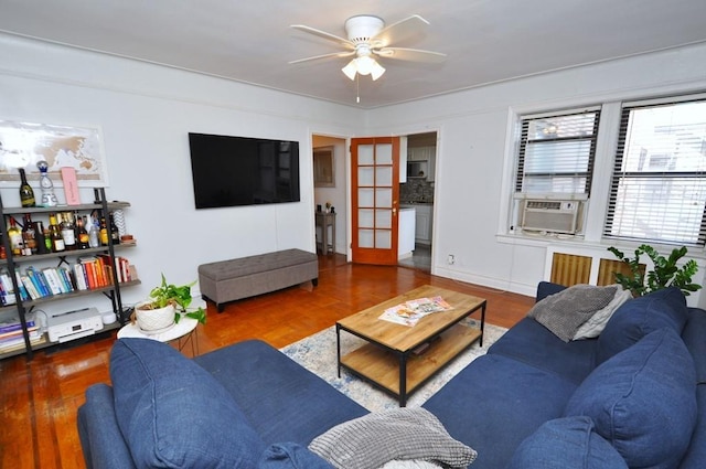 living room featuring parquet flooring, french doors, ceiling fan, and cooling unit