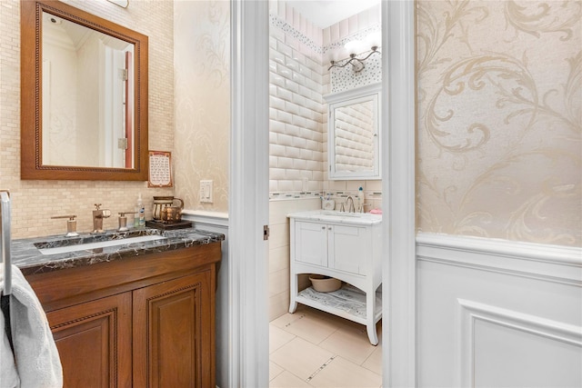 bathroom featuring tile patterned flooring, vanity, and decorative backsplash