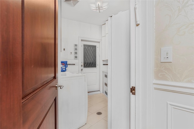 interior space featuring washer / clothes dryer and light tile patterned floors