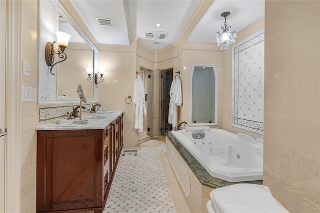 bathroom featuring vanity, tiled bath, tile walls, and crown molding