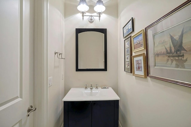 bathroom featuring a chandelier and vanity