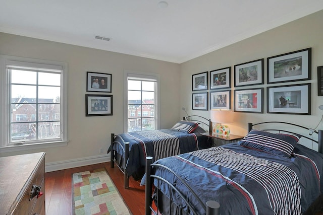 bedroom with dark hardwood / wood-style flooring