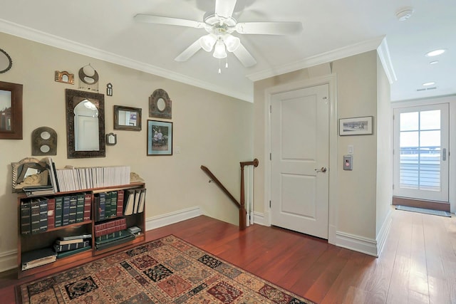 entryway featuring crown molding, ceiling fan, and hardwood / wood-style flooring