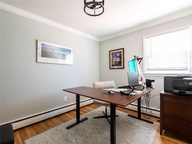 home office featuring baseboard heating, light hardwood / wood-style flooring, and ornamental molding